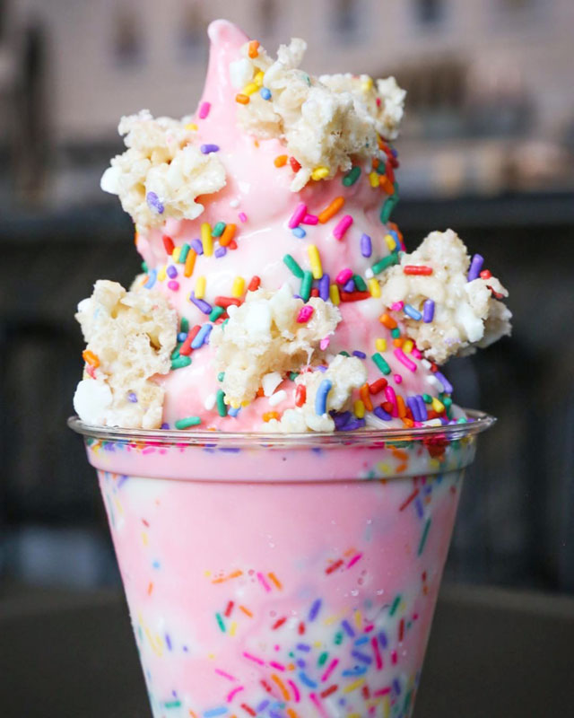 Unicorn stacker with pink marshmallow soft serve ice cream, rainbow white chocolate rice krispie treats, marshmallow sauce and rainbow sprinkles // courtesy Cow Tipping Creamery