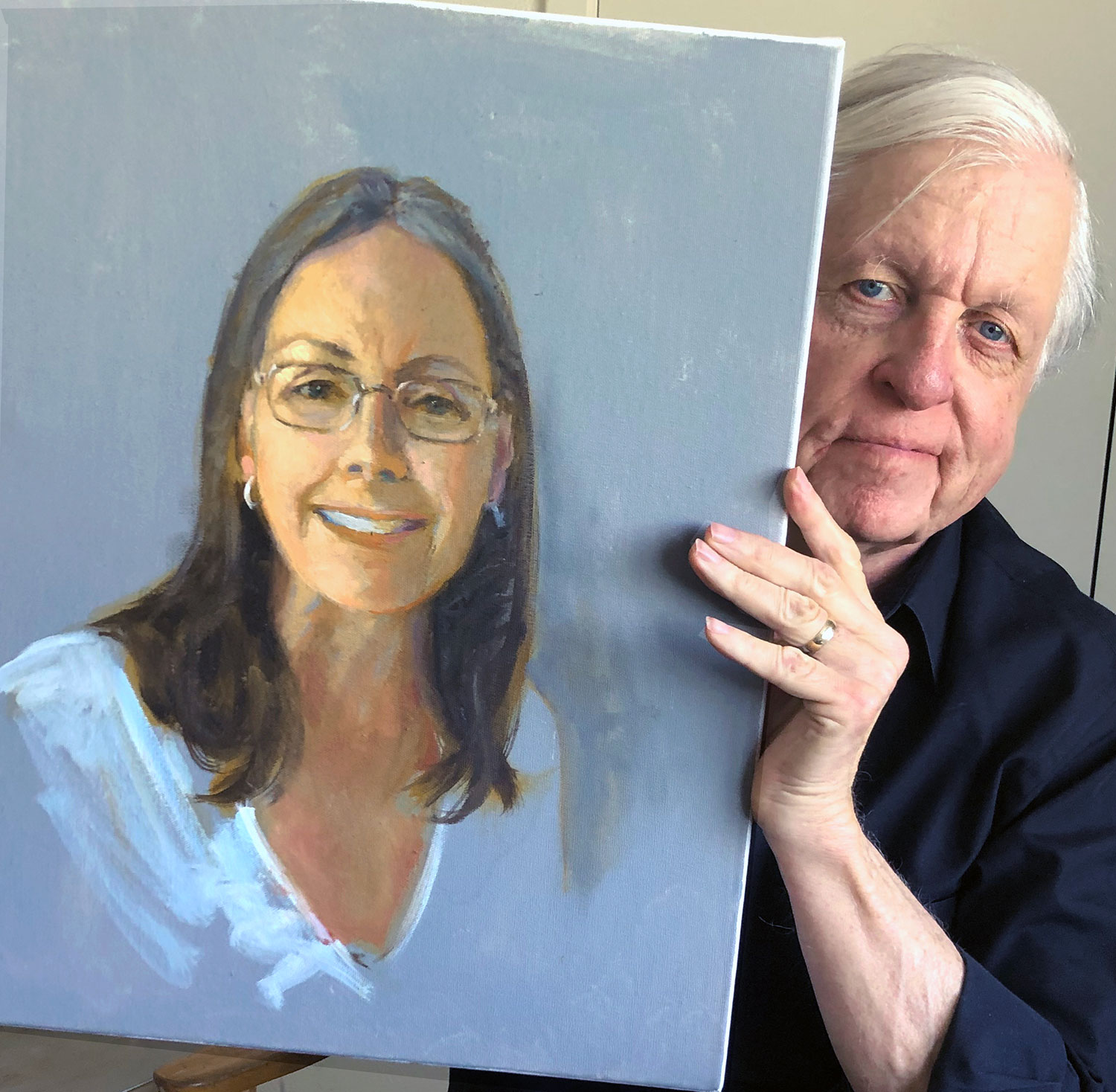 Gene Dillard with his portrait of another artist in the group // courtesy Gene Dillard