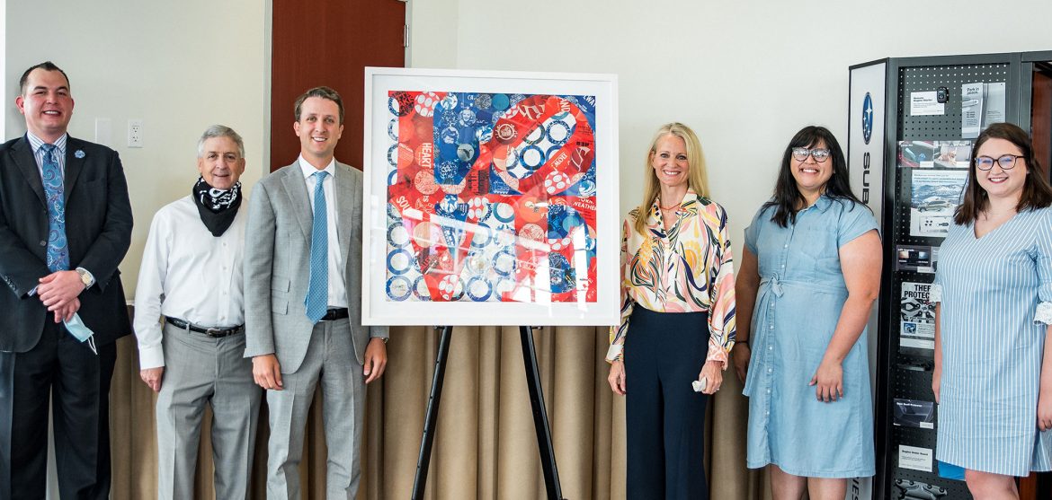 (from left) James Conroy, General Manager, Ewing Subaru of Plano; Fin and Finley Ewing, Owners/Operators, Ewing Subaru of Plano; Brenda Bogart, Artist; Anna Kurian and unnamed representative from North Texas Food Bank // courtesy Ewing Subaru of Plano
