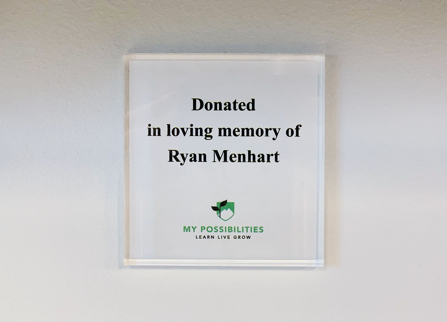 A plaque underneath one of Ryan's whiteboards // courtesy MP