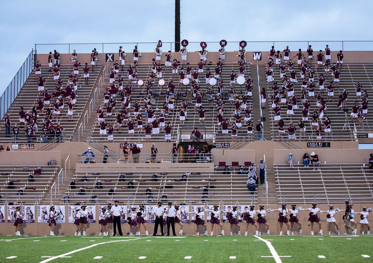 The band sits on the visitors' side at a Plano Senior High game // photo Kim Peichel Photography