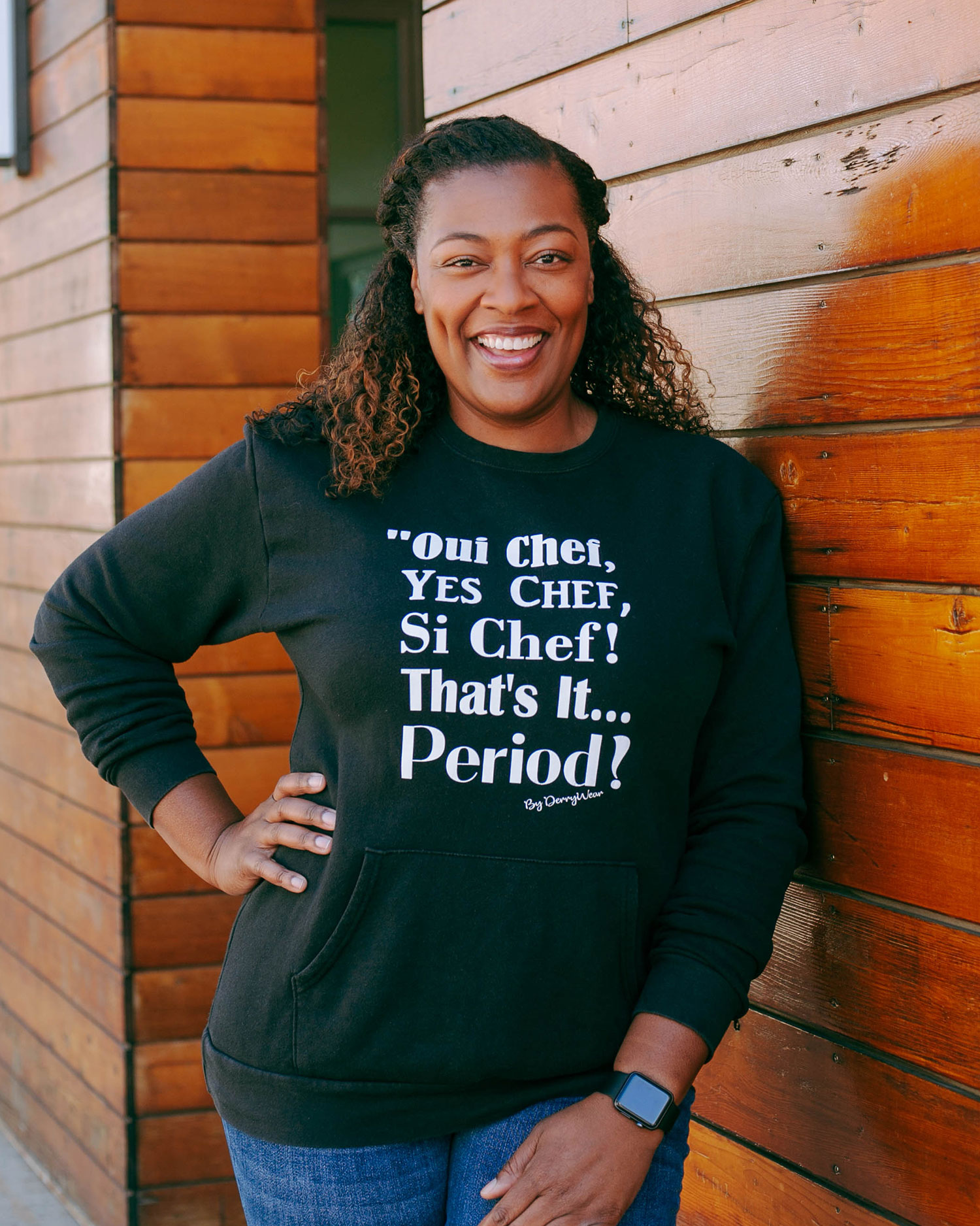 Chef Tiffany Derry outside Plano's Legacy Hall wearing a shirt from her own DerryWear Collection // photo Hunter Lacey