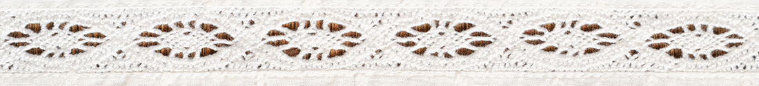 Getty laces Closeup of white cotton fabric with lace borders for background. Top view.