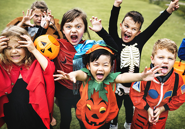 Little kids at a Halloween party. Getty Image.