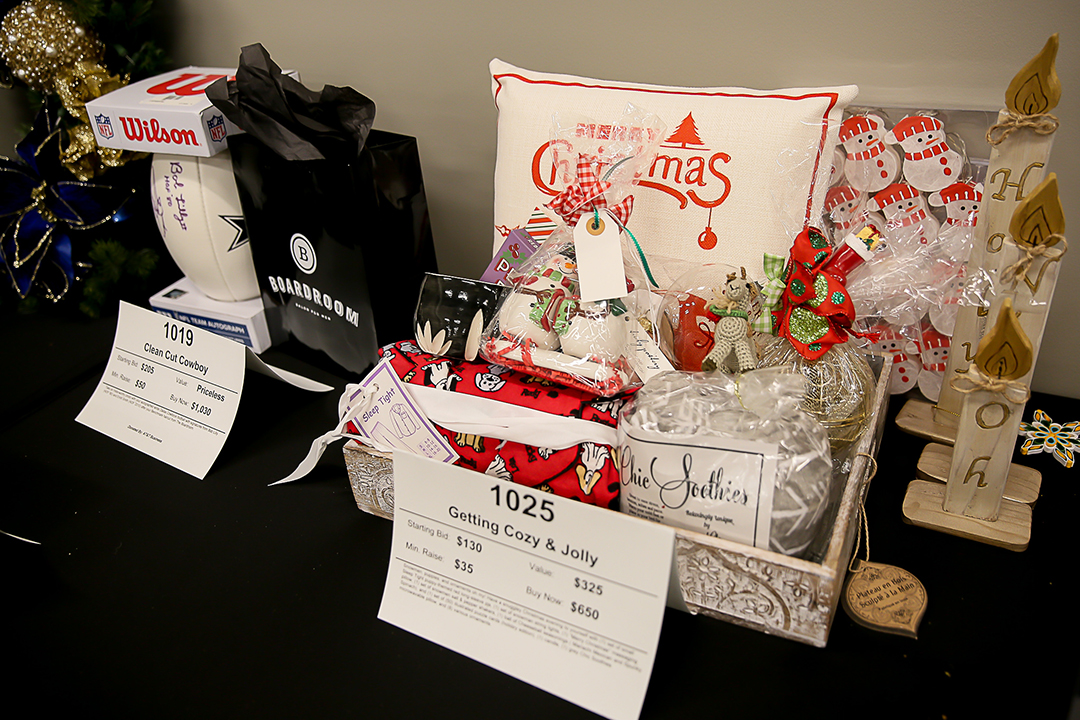A basket of goods for the auction at Junior League of Collin County’s annual ’Neath the Wreath holiday market and gift. Photo courtesy of Junior League of Collin County