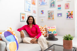 Taylor Shead reclines among colorful art. Photo by Yuvie Styles