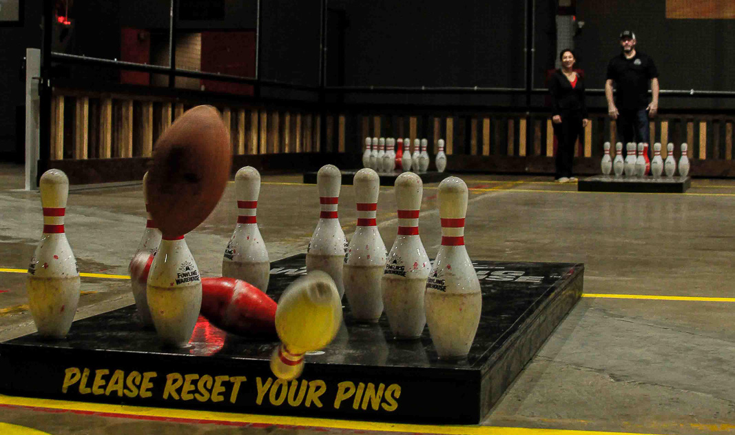 Bowling pins hit by a football at Fowling Warehouse photography Kelsey Shoemaker