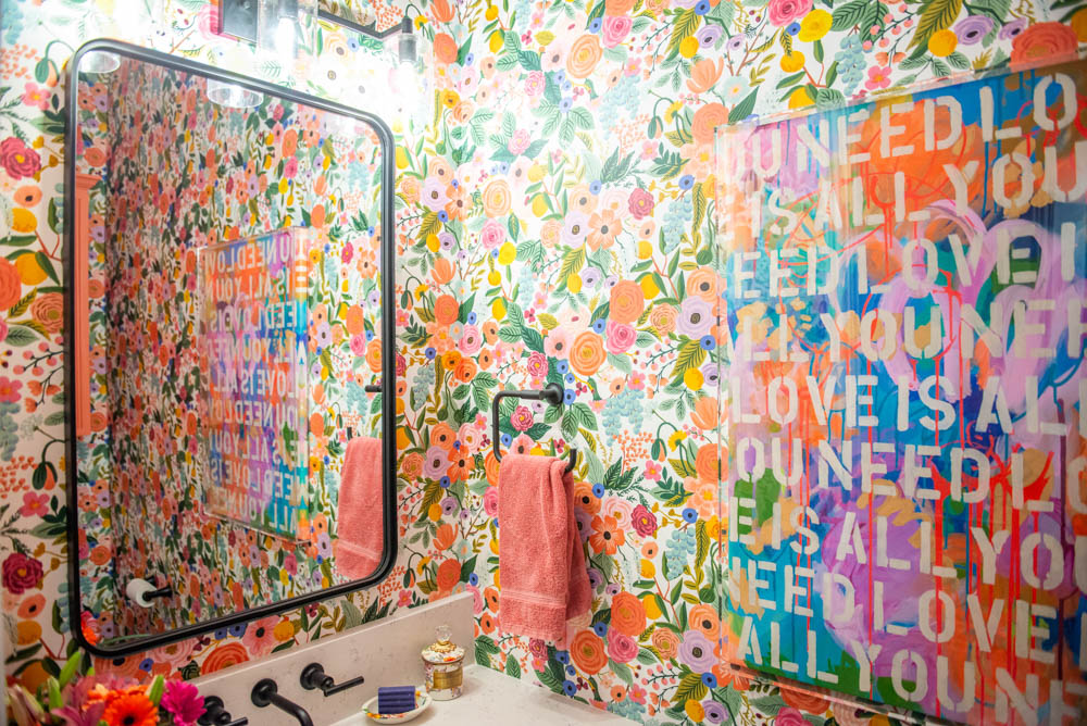 Pickering's powder room with bright floral wallpaper. Photo by Lauren Allen.