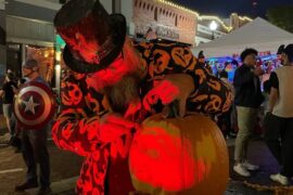 From Visit Plano. Man carving pumpkin