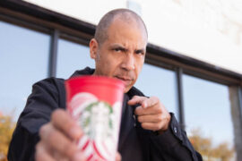 Winter enjoys a coffee outside one of the 20,000 he's visited.