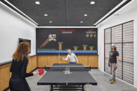 Splunk office ping pong table with video game wall art. Courtesy of Garrett Roland via IA Interior Architects.