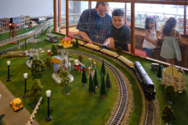Children Viewing a Model Train Exhibit