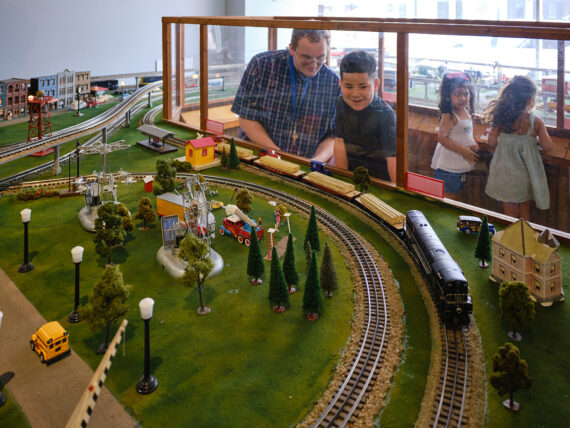 Children Viewing a Model Train Exhibit